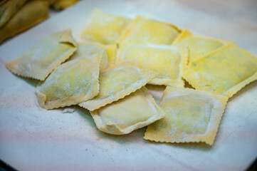 Italian food, fresh home made stuffed pasta tortelli or ravioli dumplings ready to cook, Parma, Emilia Romagna, Italy