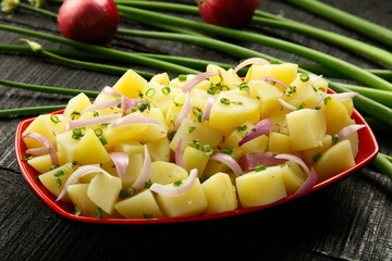 Potato salad with organic herbs and vegetables.