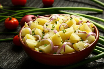 Potato cheese salad with exotic  organic herbs. Healthy vegetarian diet foods background.