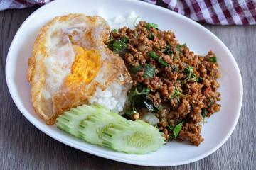 Stir-fried basil with minced pork and fried egg, popular Thai food.