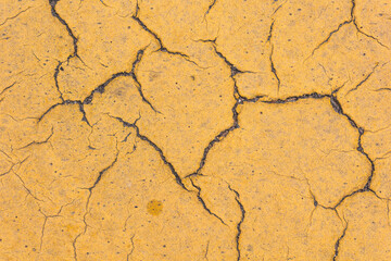 Old yellow line on the road as abstract background