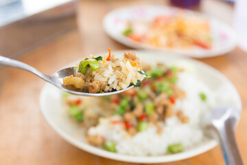 Rice topped with stir-fried pork and basil