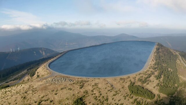 Pumped water storage hydroelectric plant reservoir aerial drone view