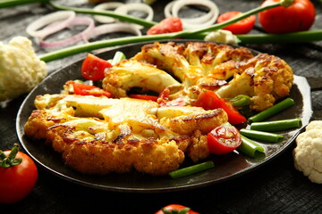 Traditional cooking recipes- homemade  grilled cauliflower and vegetables in iron skillet.
