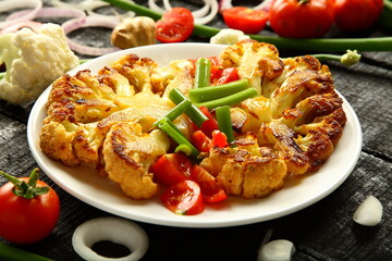 Delicious grilled cauliflower and vegetables, cooked with exotic spices and herbs.