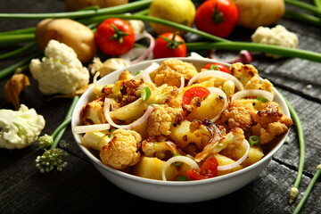 Healthy vegan appetizer, homemade roasted cauliflower - vegetarian curry dishes,