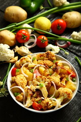 Bowl of delicious homemade grilled cauliflower  with exotic spices.