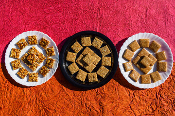 Tasty Indian sankranti festival special sweets Chiiki. Three types of chikkis like Peanut, Rajgira or Amaranth and Crushed peanut chikki bars