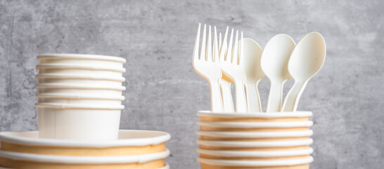 Eco friendly food packaging on table background. natural container: cup, plate, spoon and fork. zero waste, pollution, earth day, free plastic, world Environment day concept