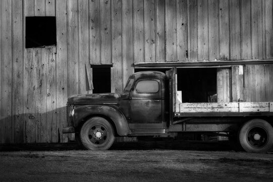 Vintage International Flatbed Truck and Old Wooden Barn. Viewed in the agricultural capital of western Washington state-the Skagit Valley. Brings back memories of time gone by.