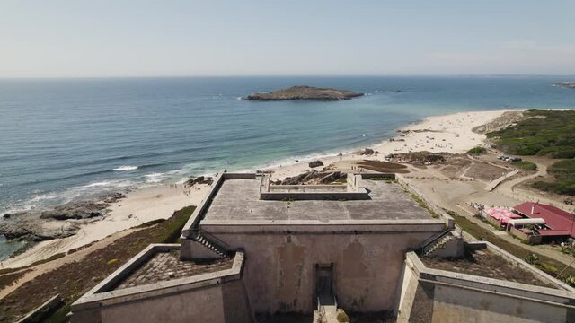 Fly over Nossa Senhora da Queimada fort, Pessegueiro beach and Island, Porto Covo, Portugal