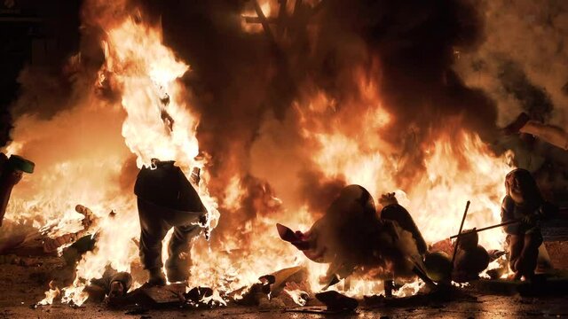 Falla with caricatures burning down during the night of Crema in Valencia, Spain.