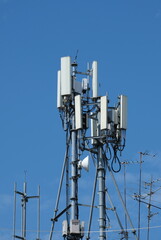 Cellular antenna steel towers in blue sky