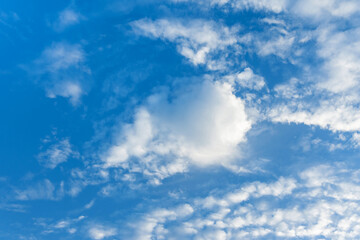 Blue sky with white fluffy clouds
