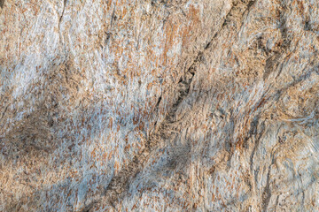 Detail of stone texture for background. Surface of the marble with brown tint