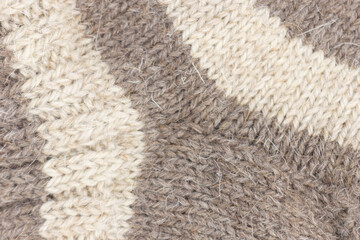 Cozy knitted socks and skeins. Close-up.