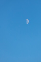 clear blue sky on a frosty day with a crescent moon