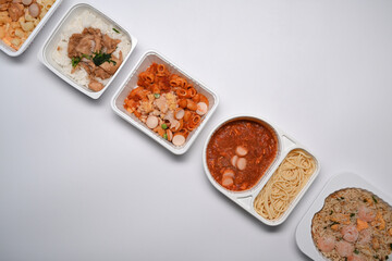 Above view of various frozen meal against on white background.