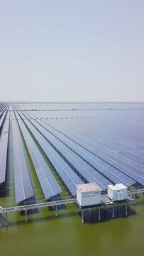 aerial view of solar power panels over water