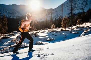 Mountaineer backcountry ski walking ski alpinist in the mountains. Ski touring in alpine landscape...