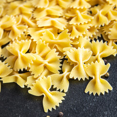 farfalle raw pasta cooking ingredient italian meal food snack on the table copy space food...