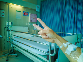 Fototapeta na wymiar patients Coronavirus, the Covid-19 raise fingers fighting between them. The treatment to normal in the hospital.soft focus.shallow focus effect.