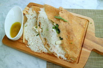 Classic French savory crepe stuffed with chicken, spinach and cheese served with olive oil