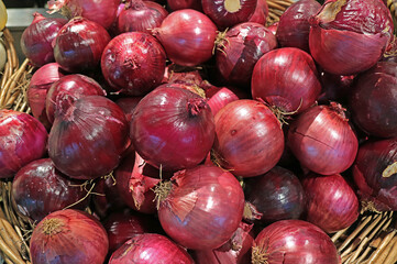 Pile of Fresh Red Onions in a Basket