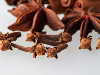 Star anise and cinnamon stick isolated on white background, top view