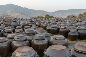 Obraz premium Platform for crocks of sauces and condiments, Jangdokdae, South Korea. 장독대, 항아리. 