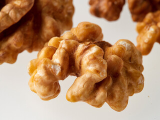 Top view of a pile of nutritious fresh walnuts without a shell isolated on a white background