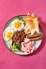 traditional breakfast on the pink background