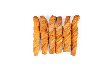 Six sticks of puff pastry isolated on white background, top view