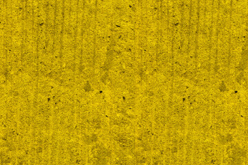 Yellow color rough concrete wall surface for texture background