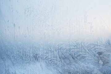 Abstract frost pattern. Frozen noisy window on the cold winter. Texture of ice on window.