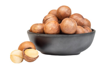 Macadamia nuts in bowl isolated