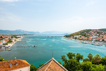 Naklejka na ściany i meble Aerial panoramic view of Trogir town, Croatia. Ancient building in old town, view to river and harbor.