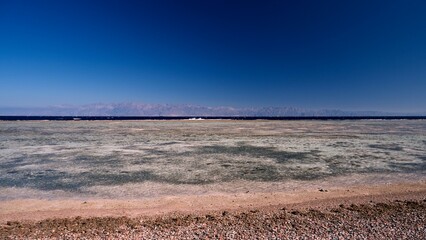 Beautiful red sea view with mountains and cloudy sky at dawn