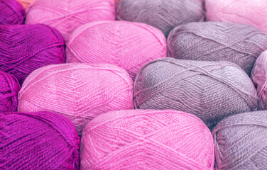 Vintage Knitting needles and yarn on wooden background. natural wool knitting background. knitting yarn for handmade winter clothes. Close Up of yarn balls. Rainbow colors. Place for text, banner.