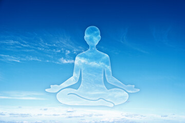 Mindfulness and meditation concept. Person silhouette and sky.