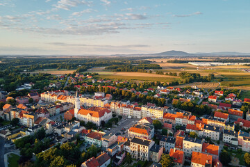 Aerial view of suburban neighborhood, Residential district with buildings and streets at small european town at sunset