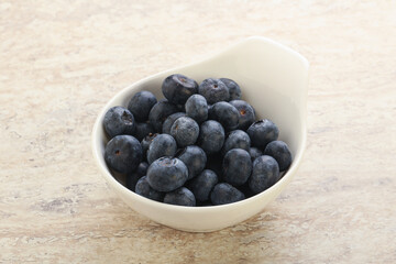 Sweet ripe blueberry heap in the bowl