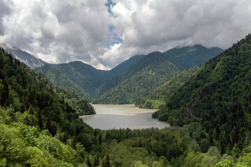Obraz na płótnie Canvas Amazing Landscape View of Riza Lake in Abkhazia in Summer Cloudy Day