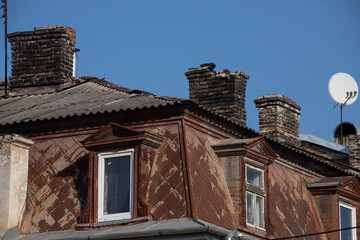 the roof of the house is covered with a tin with patterns