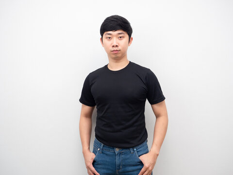 Man black shirt with jeans stand confident looking