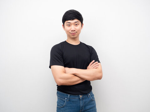 Asian man black shirt and jeans cross arm with smile portrait
