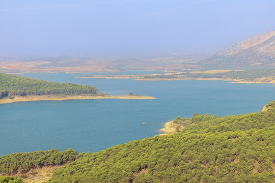 The Guadalhorce reservoir coming out of the morning mist, seen from the outlook of the three reservoirs in Campillos