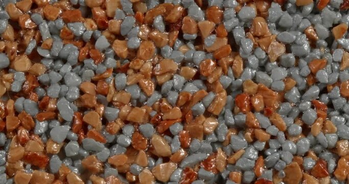 Close-up texture of fine marble chips. Amber and blue color.