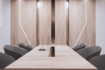 Modern meeting room interior with furniture and glass items on table. Wooden wall. 3D Rendering.