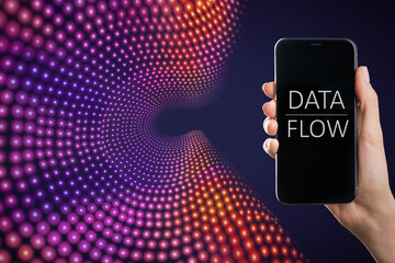 Close up of hand holding smartphone with text on screen on creative big data flow background. Technology, cyberspace, science and digital stream concept.